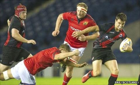 Matt Scott escapes the clutches of Munster