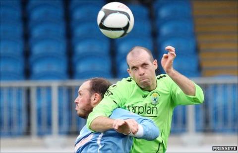 Ballymena's James Costello and Dungannon's Adam McMinn