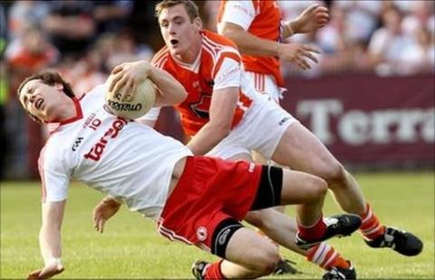 Tyrone's Colm Cavanagh and Armagh's Kieran Toner