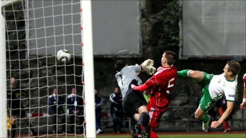 Kevin Doyle leaps to fire in the opener for the Republic in Andorra