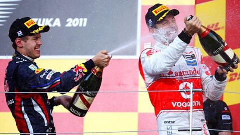 Red Bull's Sebastian Vettel and McLaren's Jenson Button celebrate