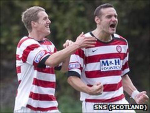 Hamilton's Mark McLaughlin celebrates with a team-mate after scoring against Livingston