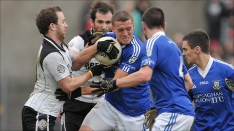 Dromore's Paddy Montague is tackled in the semi-final against Omagh