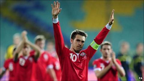 Wales captain Aaron Ramsey leads the celebrations in Sofia