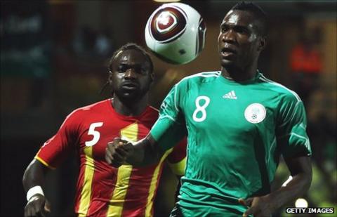 Ghana's John Mensah and Nigeria striker Ideye Brown (right)