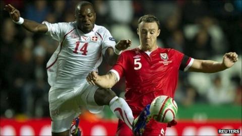 Darcy Blake challenges Innocent Emeghara of Switzerland during Wales' 2-0 Euro 2012 qualifying win