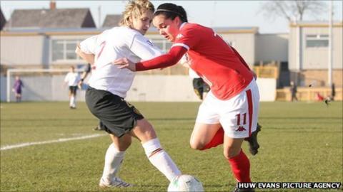 Wales' Gwennan Harries goes past Belgium's Maud Coutereels in the UEFA Women's Championship 2009