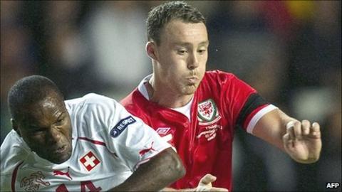 Wales defender Darcy Blake challenges Switerland's Innocent Emeghara