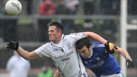 Clonoe's Shane O'Hagan beat Hugh McNulty to the ball in the Tyrone final