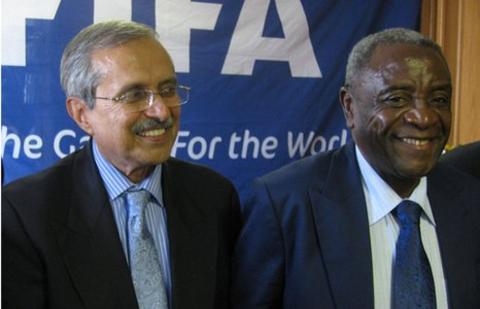 Committee chair Justice Ahmed Ebrahim and Zifa President Cuthbert Dube.