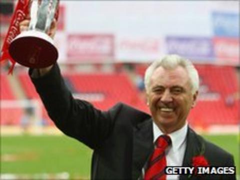 John Ryan lifting the League One play-off trophy