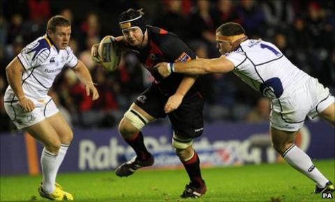 Edinburgh's Steven Turnbull is tackled by Leinster's Heinke van der Merwe