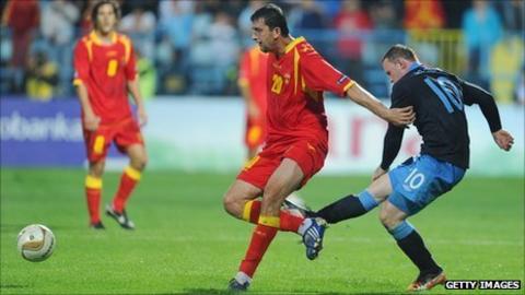 Wayne Rooney kicks out at Miodrag Dzudovic