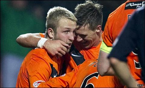 Johnny Russell (left) celebates