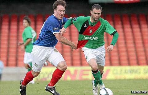Linfield's Albert Watson challenges Gary Hamilton of Glentoran in a recent league game