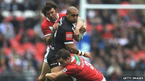 Wales captain Lee Briers and Ian Webster combine to stop Jeremy Smith of New Zealand