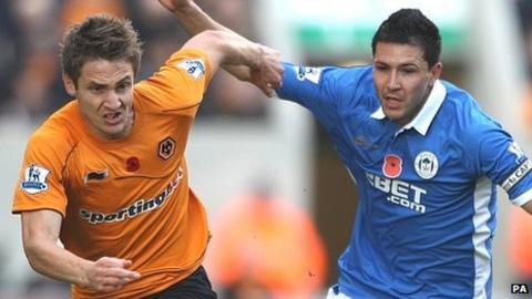 Antolin Alcaraz (right) challenges with Kevin Doyle (left)