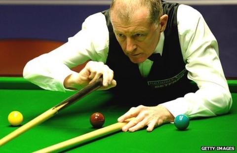 Steve Davis plays a shot with the rest during the 2010 World Championship