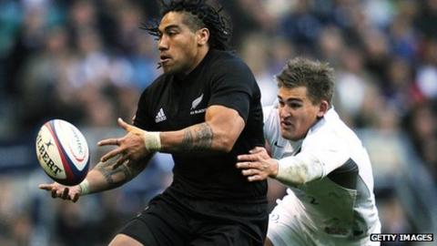 New Zealand's Centre Ma'a Nonu is tackled by England's Fly Half Toby Flood