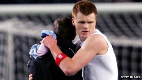 John Arne Riise embraces Craig Bellamy