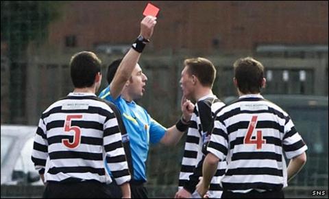 Ryan Frances is shown the red card