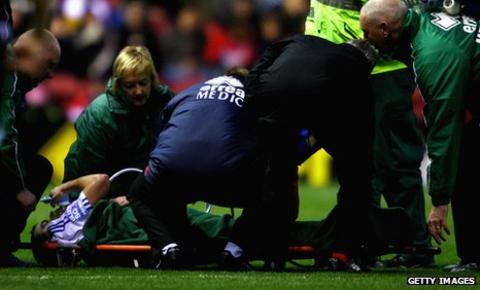 Mike Pearson receives treatment for a broken ankle and leg at Middlesbrough in 2009