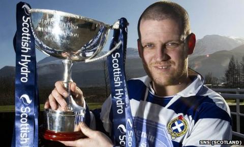 Newtonmore's Norman Campbell poses with the Camanachd Cup