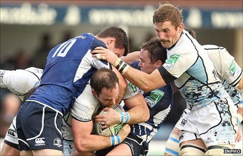 Leinster's Jonathan Sexton challenges as Graeme Morrison tries to force through
