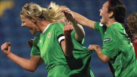 Ashley Hutton runs away in delight after scoring N Ireland's second goal