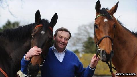 Trainer Nicky Henderson holds Long Run (L) and Binocular