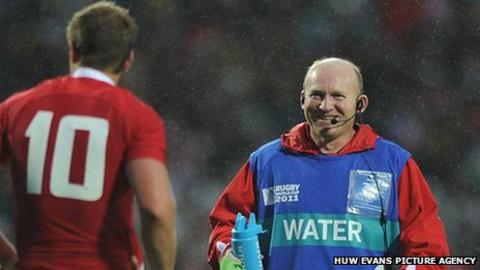 Neil Jenkins offers water and advice to Wales fly-half Rhys Priestland