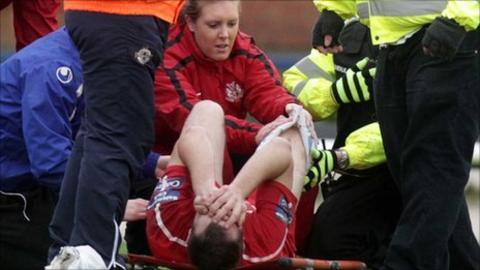 Tim Mouncey is treated after suffering the knee injury at New Grosvenor