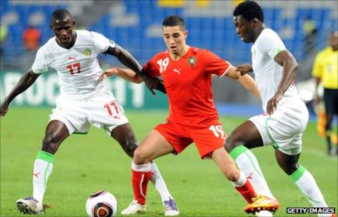 Senegalese Khassim Soumar (right) and Younes Itri (L) challenge Moroccan Lotfi Obilla (centre)