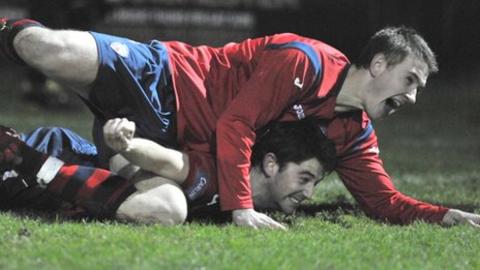 Shane Jennings jumps on top of goalscorer Curtis Allen at Suffolk Park