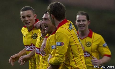 Partick Thistle players celebrate Conrad Balatoni's goal against Livingston