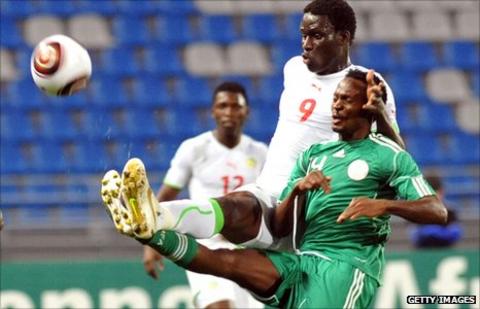 Nigeria's Obiora Nwanda (green shirt) battles for possession against Senegal