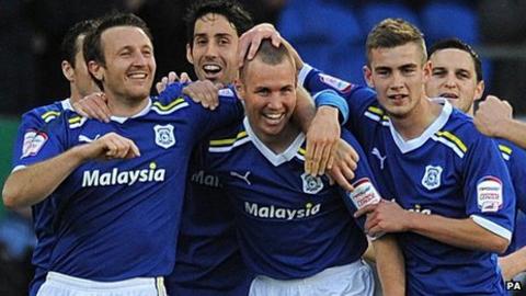 Kenny Miller (centre) is mobbed by his Cardiff team-mates after scoring against Birmingham
