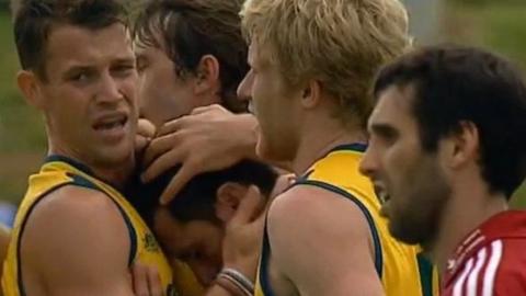 Australia celebrate scoring against Great Britain