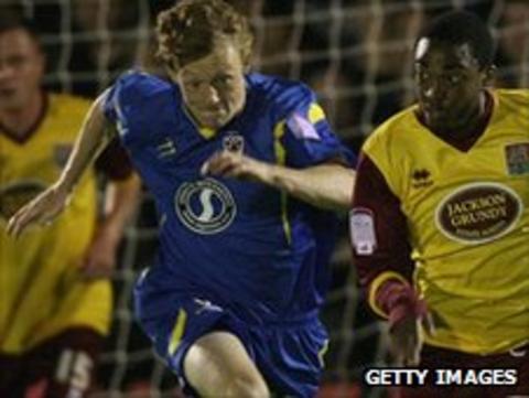 Callum McNaughton and Northampton's Marlon Jackson