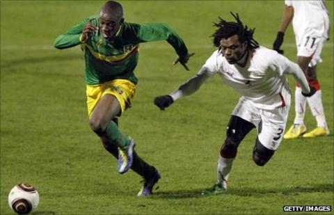 Mali's Cedric Kante (left) and Burkina Faso's Herve Zengue (right)