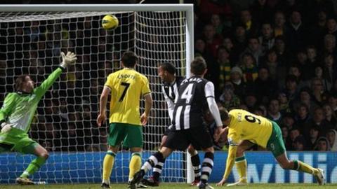 Norwich striker Grant Holt scores the fourth