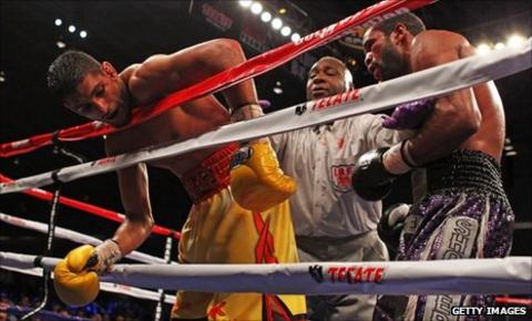 Amir Khan on the ropes against Lamont Peterson in Washington DC