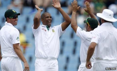 Vernon Philander (second left) is congratulated by his South Africa team-mates