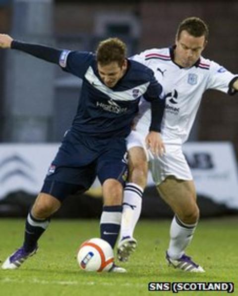 Paul Lawson and Gavin Rae battle for possession