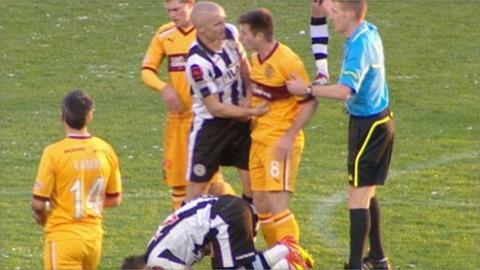 St Mirren's Jim Goodwin(centre) lands punch