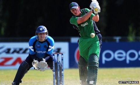 Ireland's Kevin O'Brien hits out, watched by Scotland wicketkeeper Douglas Lockhart