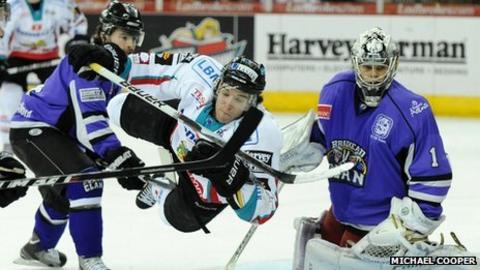 Sam Zajac's tackle sends Giants forward Darryl Lloyd flying in Tuesday's game