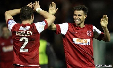 Fleetwood players celebrate beating Yeovil