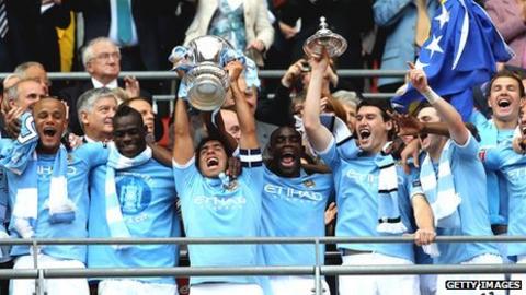 Carlos Tevez lifts the FA Cup following Man City's win over Stoke in last season's final