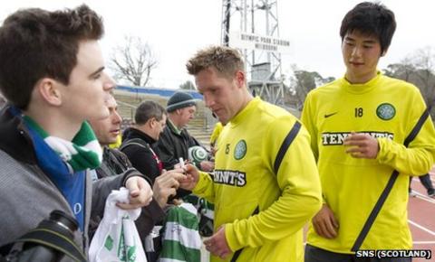 Kris Commons and Ki Sung-Yueng sign autographs for Celtic fans in Melbourne